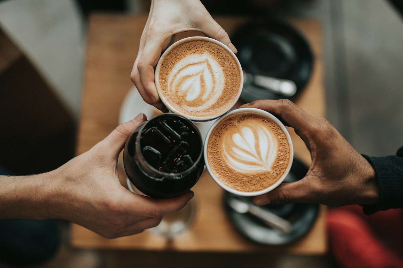Coffee shared between friends in a cafe